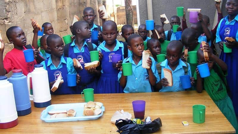 black children holding bread